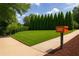 Beautifully manicured front lawn with mature landscaping and an orange address marker at 240 at 240 Patterson Se Ave, Atlanta, GA 30316