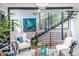 Stylish living room featuring sleek staircase, eye-catching artwork, and contemporary decor at 240 Patterson Se Ave, Atlanta, GA 30316