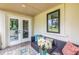 Covered patio with outdoor seating, perfect for relaxing or entertaining guests at 240 Patterson Se Ave, Atlanta, GA 30316