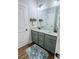 Bathroom with double sink vanity, granite countertop, and light grey cabinets at 2980 Hd Atha Rd, Covington, GA 30014