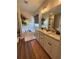 Bright bathroom showcasing soaking tub, natural light, and double vanity at 2980 Hd Atha Rd, Covington, GA 30014