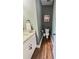 Compact powder room with granite countertop, modern fixtures, toilet and towel bar at 2980 Hd Atha Rd, Covington, GA 30014