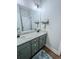 Bathroom featuring a double vanity, granite countertop, and modern fixtures at 2980 Hd Atha Rd, Covington, GA 30014