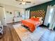 Stylish bedroom with a comfortable bed, decorative headboard, dresser and ample natural light at 2980 Hd Atha Rd, Covington, GA 30014