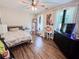 Bedroom with hardwood floors, ceiling fan, dresser, and desk workstation at 2980 Hd Atha Rd, Covington, GA 30014
