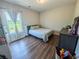 Bedroom with wood floors, large windows and light coming in at 2980 Hd Atha Rd, Covington, GA 30014