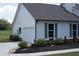 A charming home with an attached garage, well-maintained landscaping, and a paved driveway at 2980 Hd Atha Rd, Covington, GA 30014