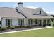 Beautiful single-story home with a covered porch, showcasing gray shutters and a well-manicured lawn at 2980 Hd Atha Rd, Covington, GA 30014