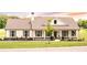 Charming single-story home featuring a covered porch, gray shutters, and a beautifully landscaped yard at 2980 Hd Atha Rd, Covington, GA 30014