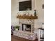 The living room features a brick fireplace with a wooden mantel and a mounted television above it at 2980 Hd Atha Rd, Covington, GA 30014