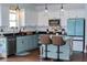 A vibrant kitchen featuring stylish countertops, an island with bar stools, and modern appliances at 2980 Hd Atha Rd, Covington, GA 30014