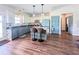 Bright kitchen boasts modern cabinetry, a central island with seating, and stainless steel appliances at 2980 Hd Atha Rd, Covington, GA 30014