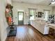Cozy living room with hardwood floors, a comfortable sofa, and ample natural light at 2980 Hd Atha Rd, Covington, GA 30014