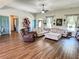 Open living room with a large sectional sofa, hardwood floors, and a cozy atmosphere at 2980 Hd Atha Rd, Covington, GA 30014