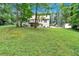 Expansive backyard with a well-maintained lawn, trees, and a charming two-story home in a desirable location at 40 Picketts Forge W Dr, Acworth, GA 30101