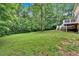 Large, well-maintained backyard with lush greenery, offering ample space for recreation and relaxation at 40 Picketts Forge W Dr, Acworth, GA 30101