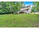 Expansive backyard with a well-maintained lawn, trees, and a charming two-story home in a desirable location at 40 Picketts Forge W Dr, Acworth, GA 30101
