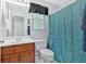 Bathroom featuring wood vanity, sink, toilet, and framed mirror above sink at 40 Picketts Forge W Dr, Acworth, GA 30101