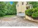 Side view showcasing a two-car garage and lush greenery enhancing the property's privacy at 40 Picketts Forge W Dr, Acworth, GA 30101