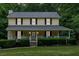 Charming two-story home with a welcoming front porch and manicured landscaping for curb appeal at 40 Picketts Forge W Dr, Acworth, GA 30101