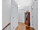 Bright upstairs hallway featuring 2 closets and light hardwood floors at 40 Picketts Forge W Dr, Acworth, GA 30101