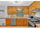 Functional kitchen featuring wood cabinets, stainless steel appliances, and ample counter space at 40 Picketts Forge W Dr, Acworth, GA 30101