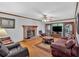 Spacious living room with a brick fireplace, hardwood floors, and comfortable seating at 40 Picketts Forge W Dr, Acworth, GA 30101