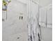 Elegant walk-in shower featuring marble tile and a built-in niche at 40 Picketts Forge W Dr, Acworth, GA 30101
