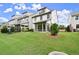 Spacious backyard featuring a well-maintained lawn, manicured landscaping, and a screened-in porch, enhancing outdoor appeal at 4137 Avid Park, Marietta, GA 30062