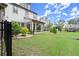 Serene backyard scene with a lush lawn and a charming screened-in porch, creating a private outdoor retreat at 4137 Avid Park, Marietta, GA 30062