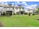 Expansive backyard view featuring a well-maintained lawn and a screened-in porch, ideal for outdoor activities at 4137 Avid Park, Marietta, GA 30062