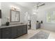 Bathroom featuring dual vanities with gray cabinetry, granite countertops, and a ceiling fan at 4137 Avid Park, Marietta, GA 30062