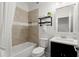 Clean bathroom with tile shower, modern fixtures, and decorative shelving unit at 4137 Avid Park, Marietta, GA 30062