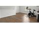 Bright bedroom with hardwood floors and a Peloton exercise bike, offering a space for fitness and relaxation at 4137 Avid Park, Marietta, GA 30062