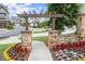 Stone gate entrance with flowerbeds and street view at 4137 Avid Park, Marietta, GA 30062