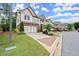 Charming two-story homes with well-manicured lawns and beautiful landscaping line a quiet street at 4137 Avid Park, Marietta, GA 30062