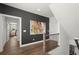 Upstairs hallway with hardwood floors, decorative artwork and an open doorway at 4137 Avid Park, Marietta, GA 30062