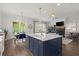 Open concept kitchen with large island, pendant lighting, stainless steel appliances, and hardwood floors at 4137 Avid Park, Marietta, GA 30062