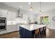 Bright kitchen featuring an island with seating, modern stainless appliances and pendant lights at 4137 Avid Park, Marietta, GA 30062