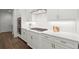 Modern kitchen featuring white cabinets, stainless steel appliances, subway tile backsplash, and wood flooring at 4137 Avid Park, Marietta, GA 30062