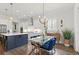 Open concept kitchen and dining area featuring a large island, stainless appliances, and wood floors at 4137 Avid Park, Marietta, GA 30062