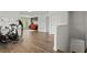 Bright living room featuring hardwood floors and a comfortable seating area with an orange sofa at 4137 Avid Park, Marietta, GA 30062