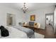 Bright main bedroom featuring a sitting area, chandelier, and access to an ensuite bathroom at 4137 Avid Park, Marietta, GA 30062