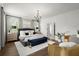 Spacious main bedroom with a chandelier, shutters, and upholstered headboard at 4137 Avid Park, Marietta, GA 30062