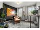 Inviting home office with dark accent wall, ample natural light, and stylish furnishings at 4137 Avid Park, Marietta, GA 30062