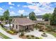 Pool house with stone columns and covered pergola leading to a patio and landscaped grounds at 4137 Avid Park, Marietta, GA 30062