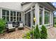 Cozy outdoor seating area with comfortable chairs and decorative pillows next to a screened in porch at 4137 Avid Park, Marietta, GA 30062
