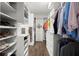Spacious walk-in closet with custom shelving and wood floors, perfect for organizing your wardrobe at 4137 Avid Park, Marietta, GA 30062