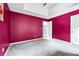 Spacious bedroom with soft carpet, vibrant walls, and an open doorway to the landing at 5115 Estonian Dr, Fairburn, GA 30213