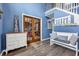 Spacious foyer with hardwood floors, a bench, and beautiful blue walls at 5115 Estonian Dr, Fairburn, GA 30213